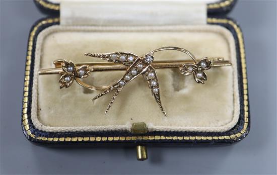 A Victorian style 9ct gold, diamond and seed pearl set swallow bar brooch, 46mm.